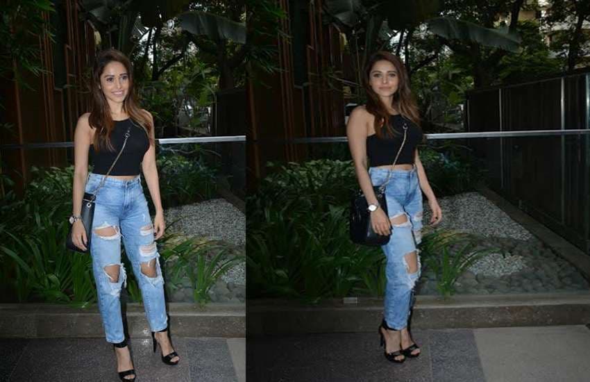 nushrat bharucha in black top and ripped jeans latest photos