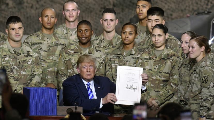 Donald trump signs defence policy bill with thesed historical changes