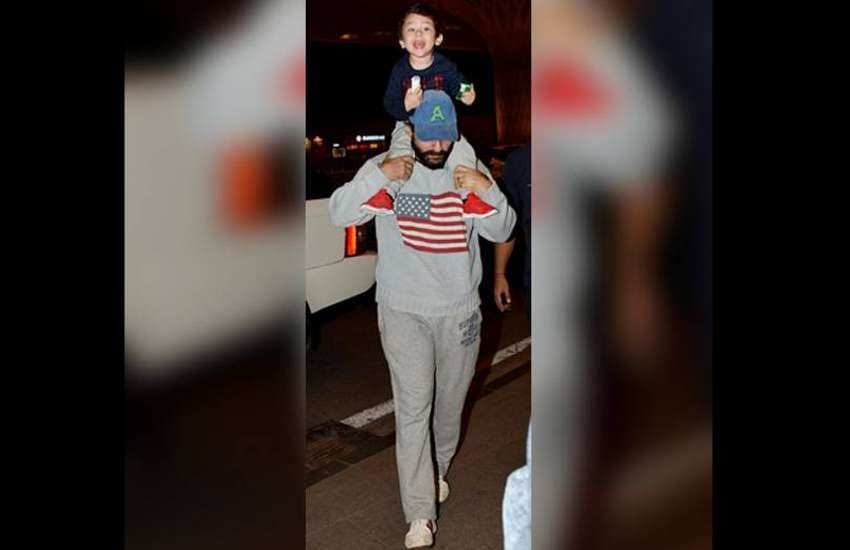 taimur ali khan riding on shoulders of saif ali khan at airport photos