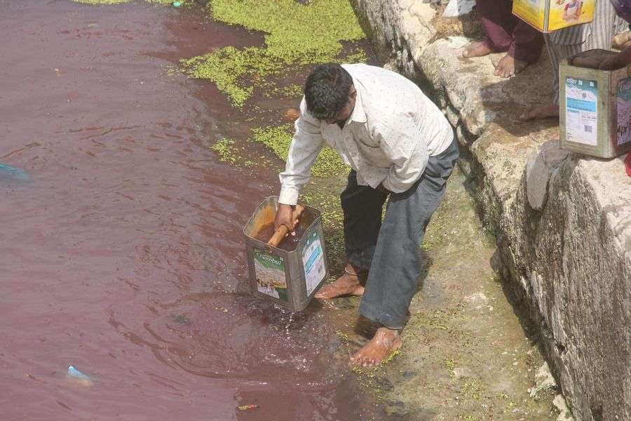 pics of People carrying water on the shoulders