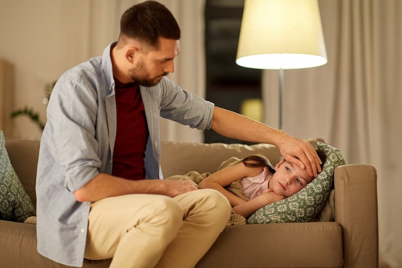 Man attending his sick daughter