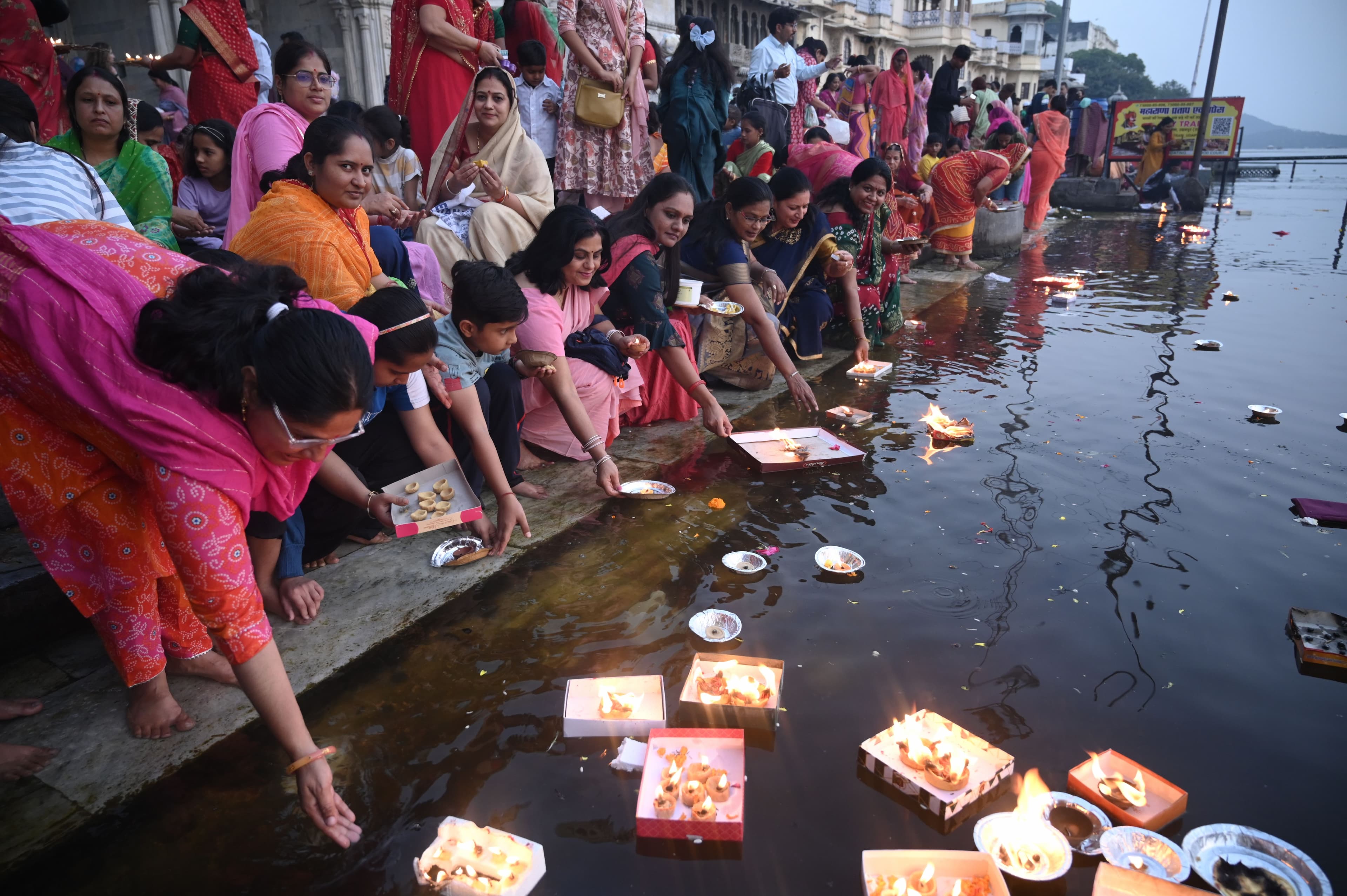 donating lamps in Pichola lake on Kartik Purnima.