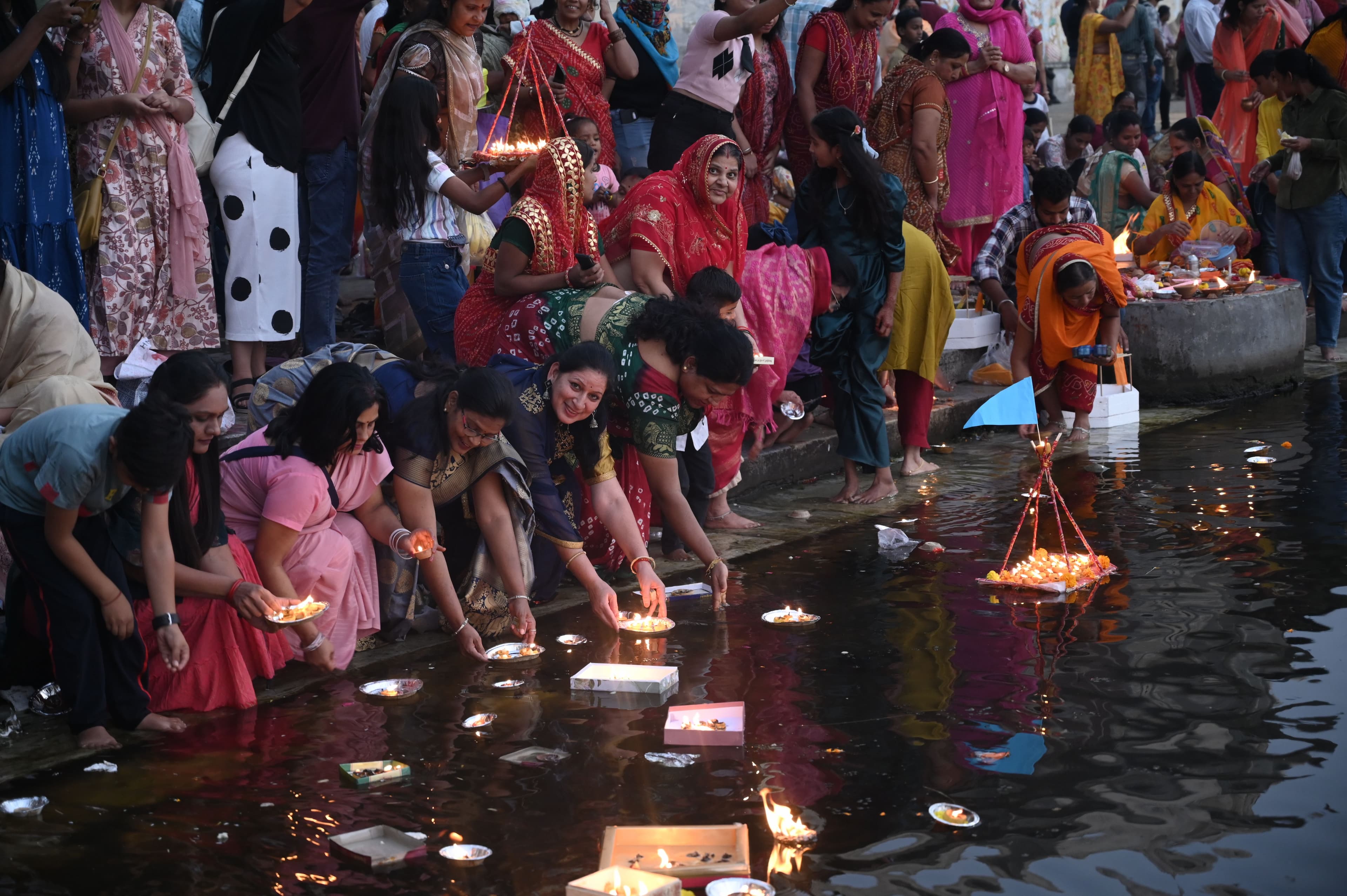 donating lamps in Pichola lake on Kartik Purnima.