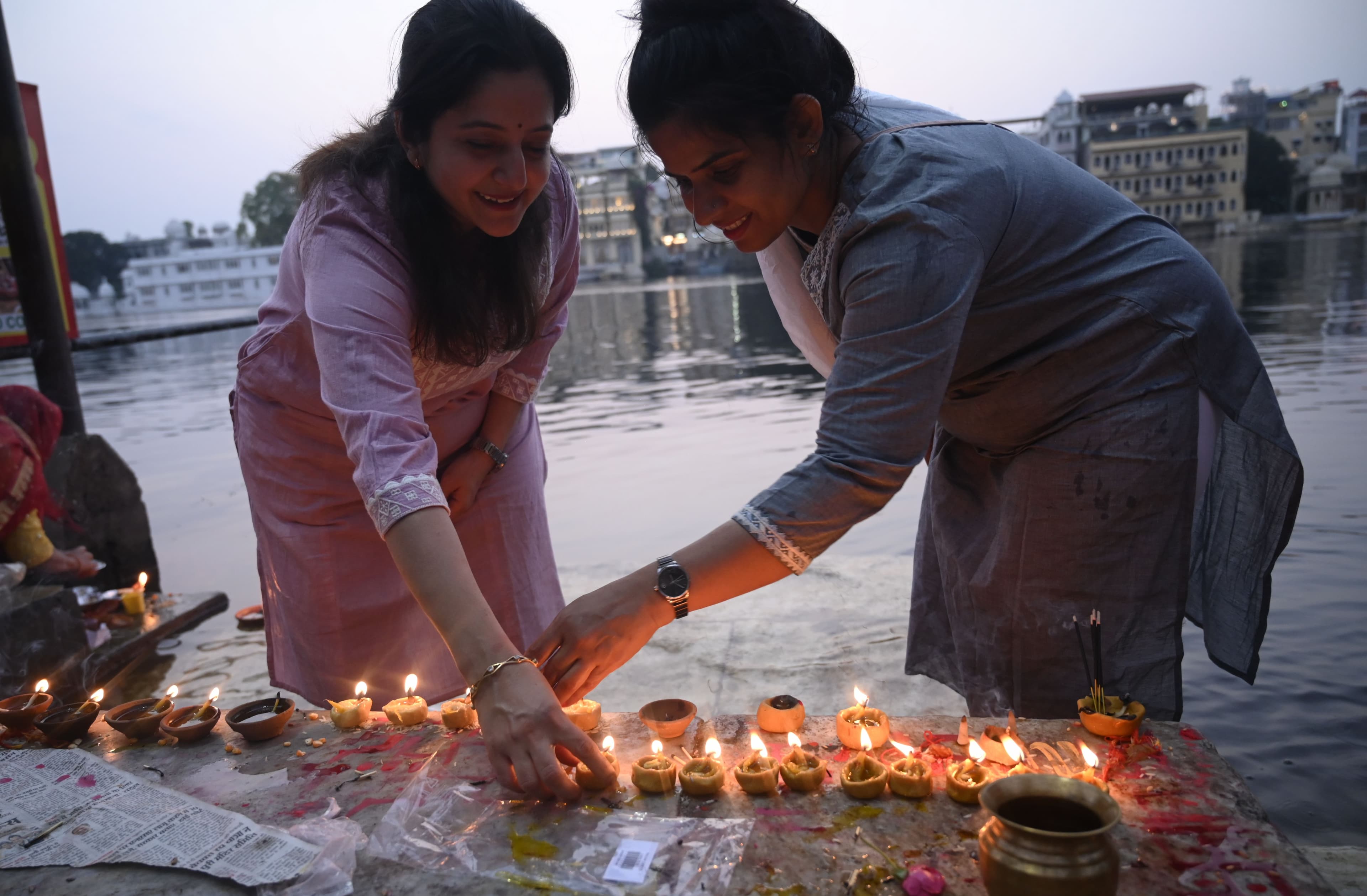 donating lamps in Pichola lake on Kartik Purnima.